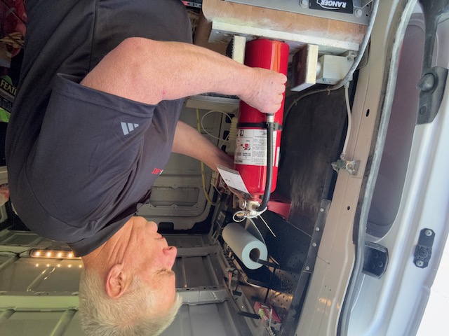 Brad at work inside the equipped service van