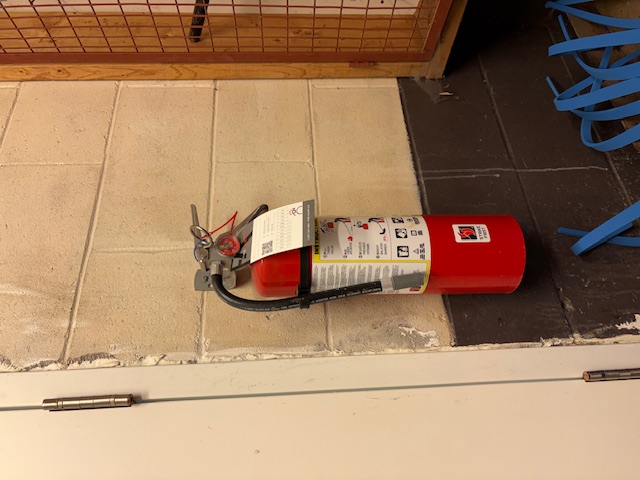 Inspected extinguisher mounted in a commercial mechanical room